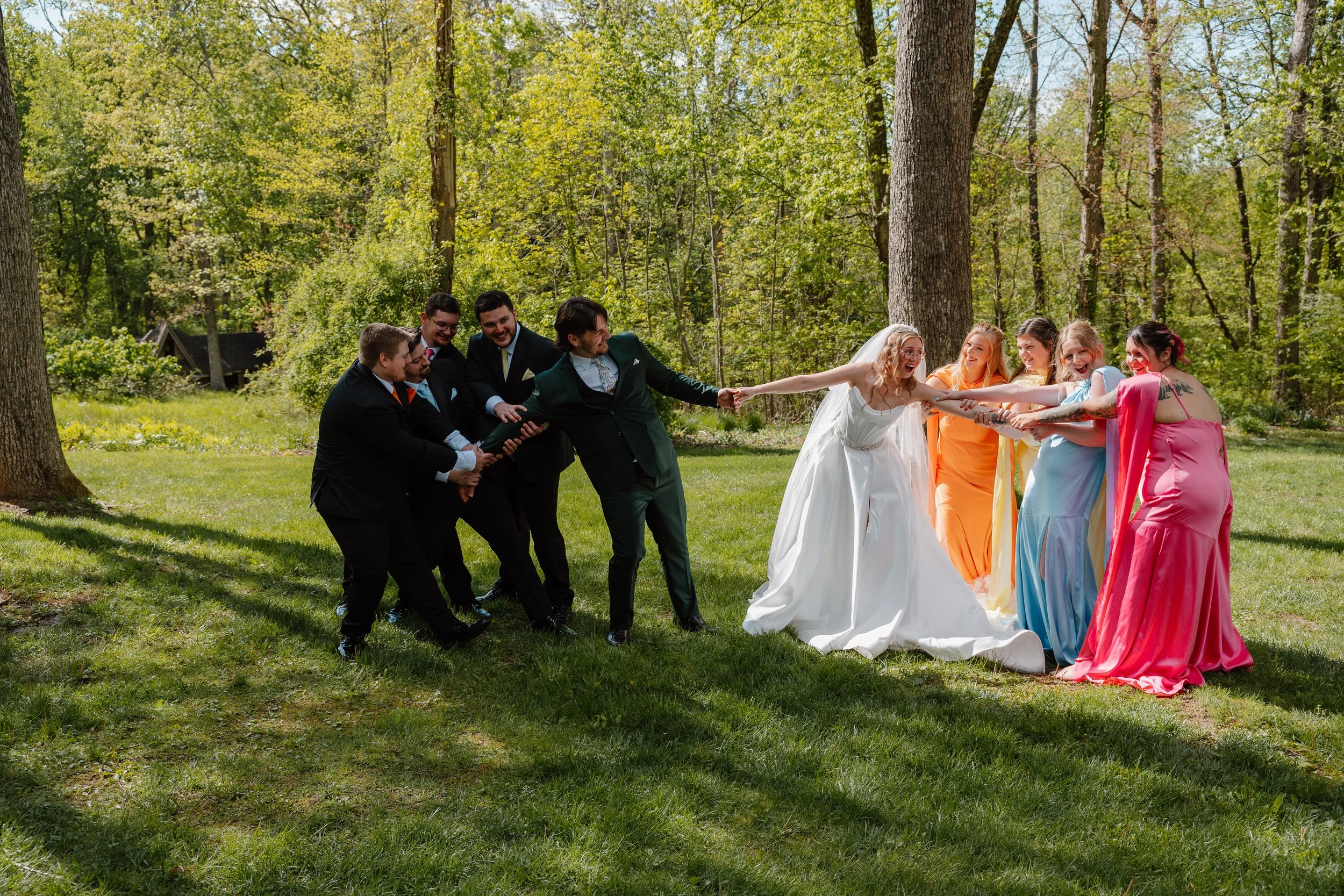 candid-tug-of-war-mohican-castle-wedding-party.jpg