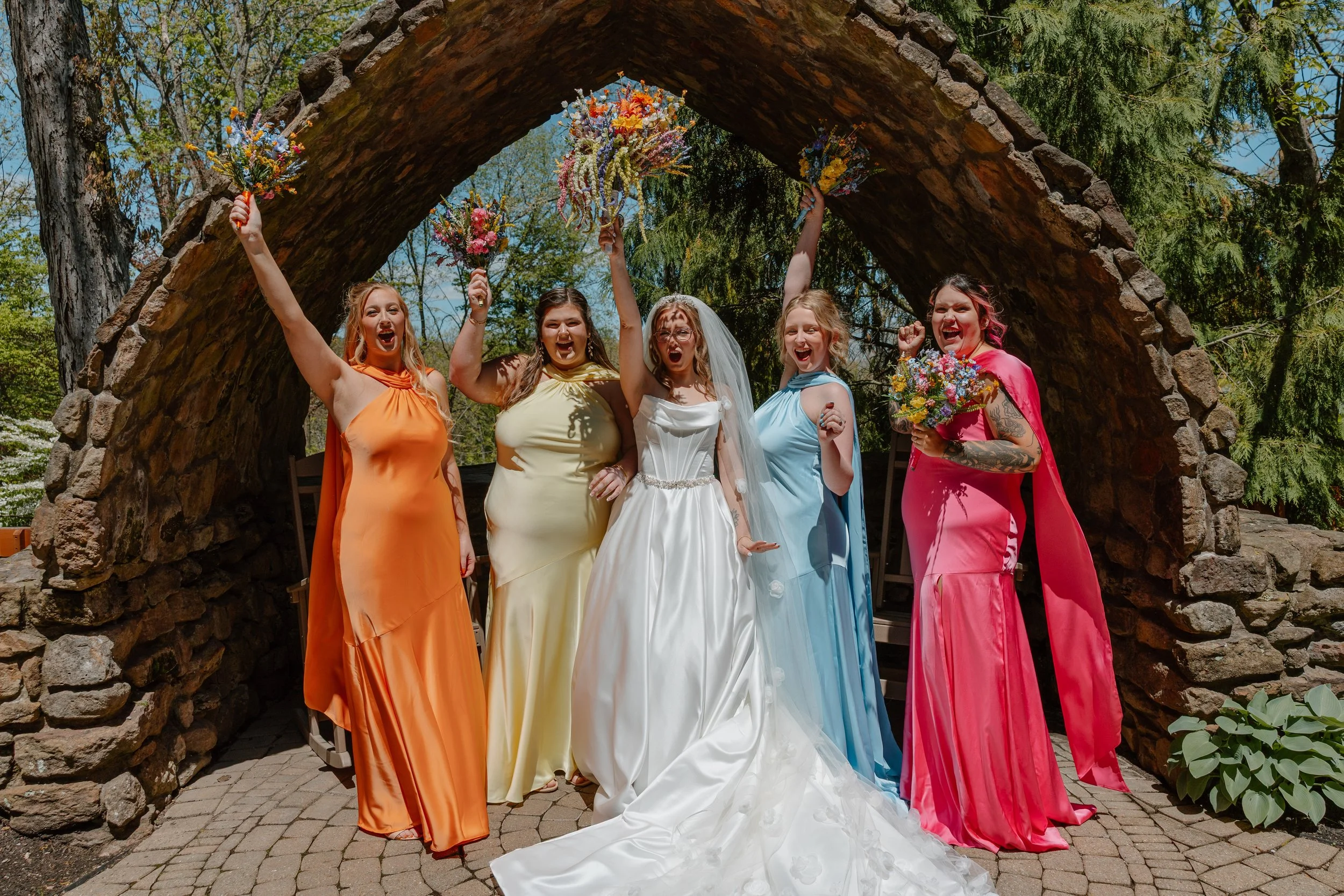 landolls-mohican-castle-bridesmaids-cheering-arch.jpg