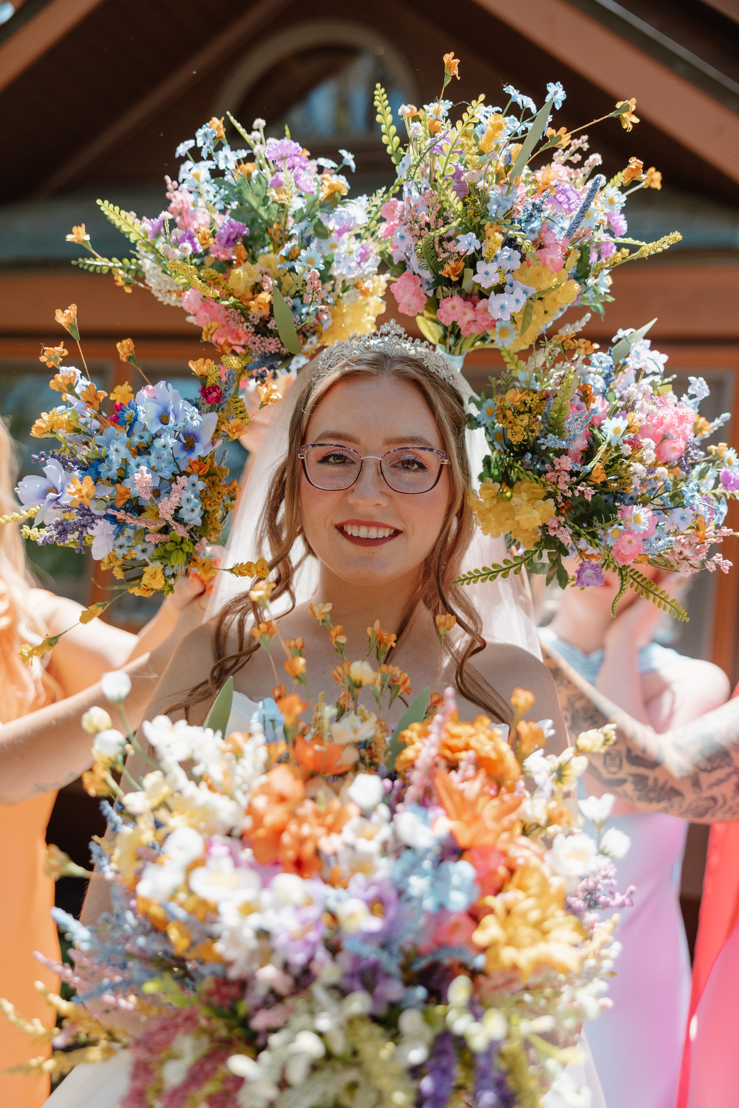 mohican-castle-bride-framed-by-bouquets.jpg