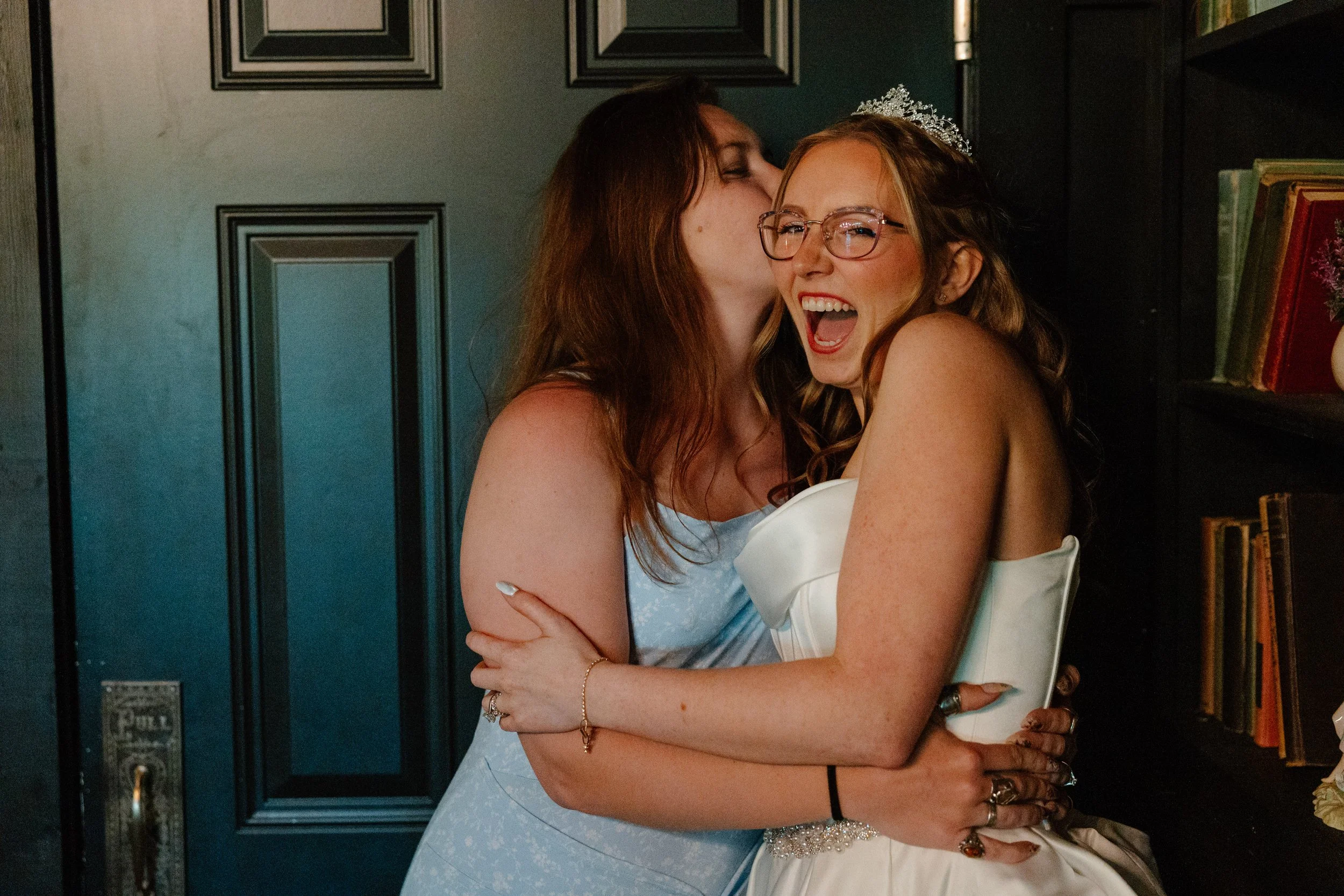 candid-reception-hug-mohican-castle-wedding.jpg