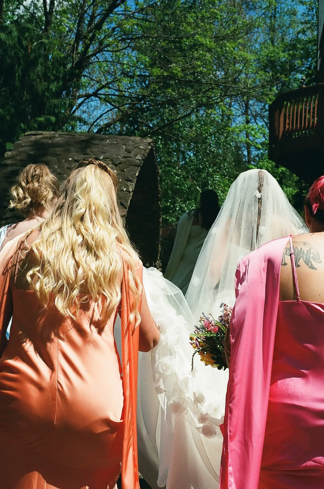 bridal-party-walking-landolls-mohican-castle.jpg