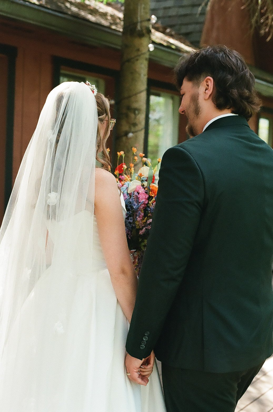 bride-and-groom-holding-hands-mohican-castle.jpg