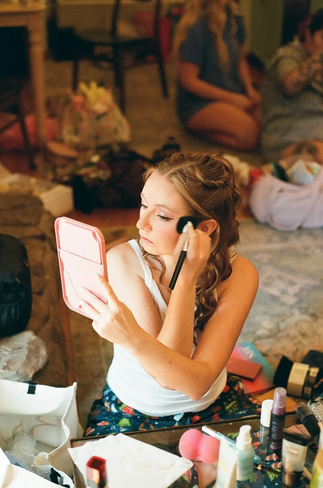 candid-bride-applying-blush-mohican-castle.jpg