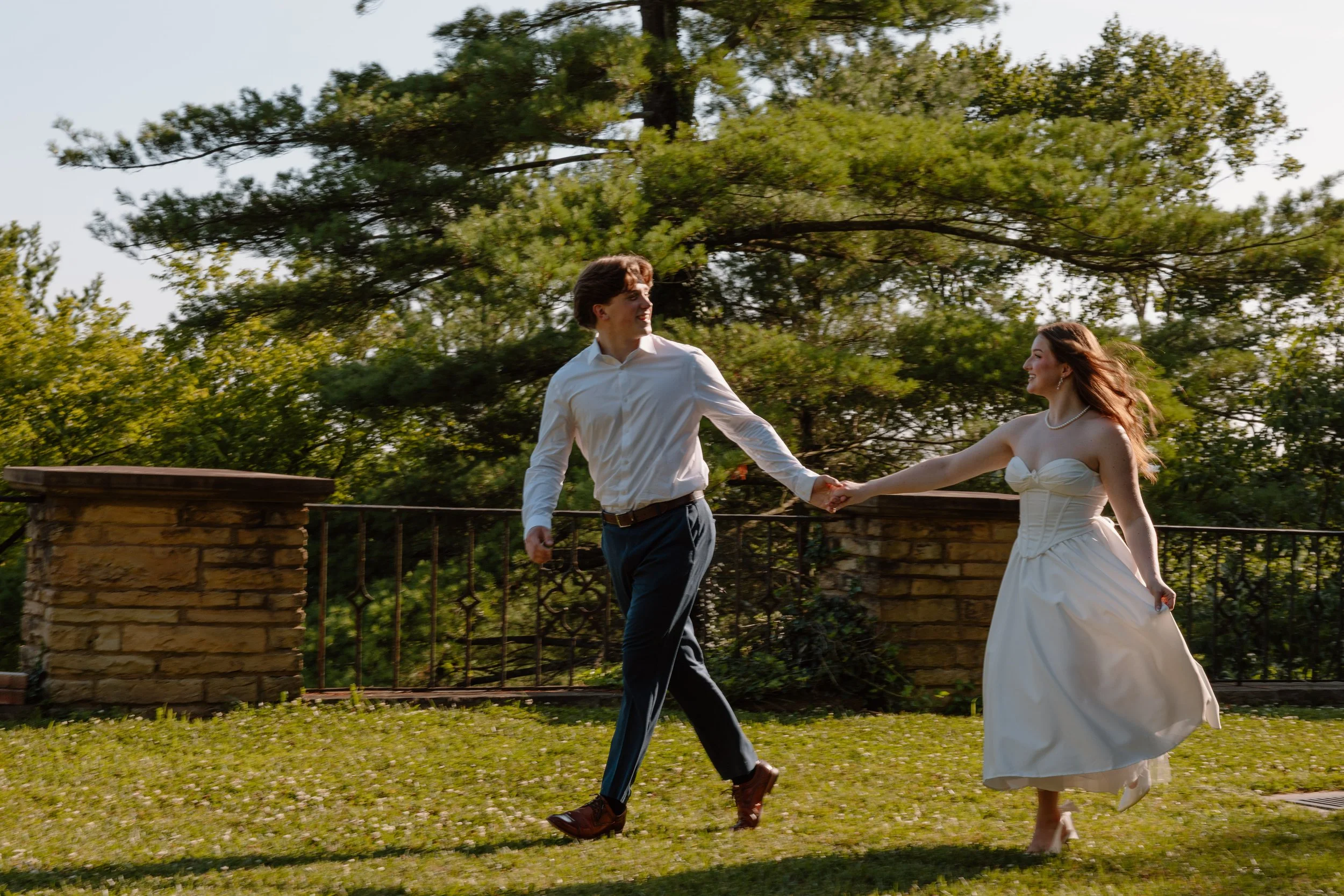 portsmouth-oh-engagement-couple-walking-lawn.jpg