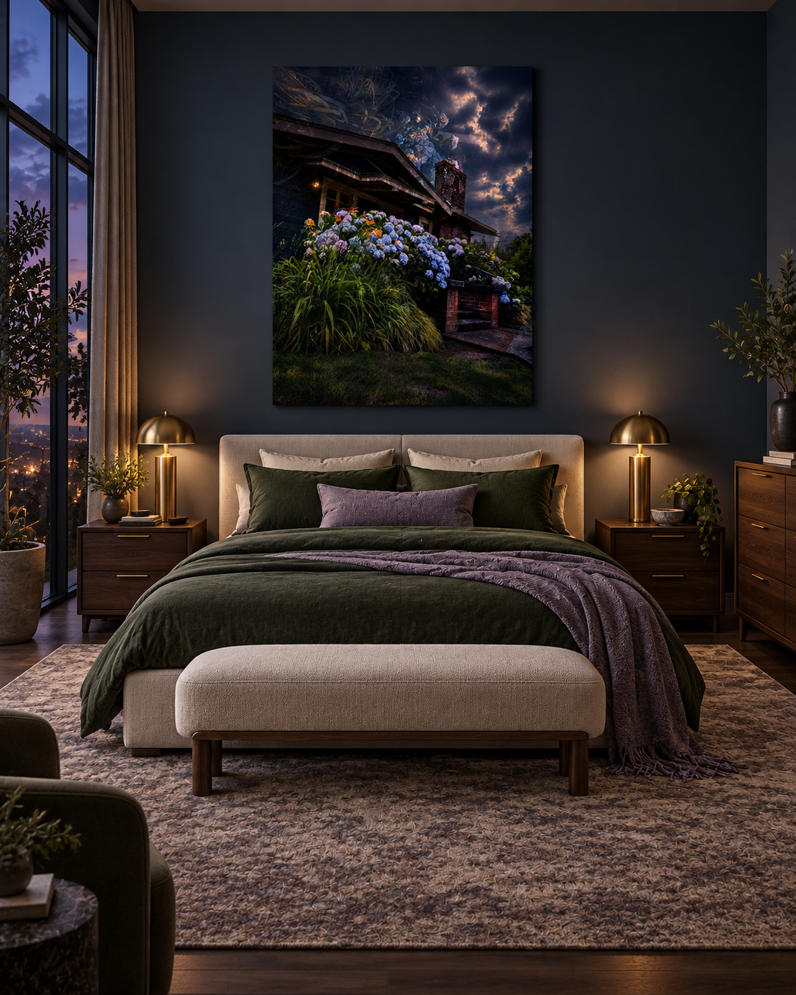 A cozy bedroom with a neatly made bed featuring green and purple pillows and a dark green comforter. On either side of the bed are matching wooden nightstands with gold lamps. A large window on the left side shows a city view at dusk. Above the bed hangs a large photograph of a house with a garden of hydrangeas under a cloudy sky.