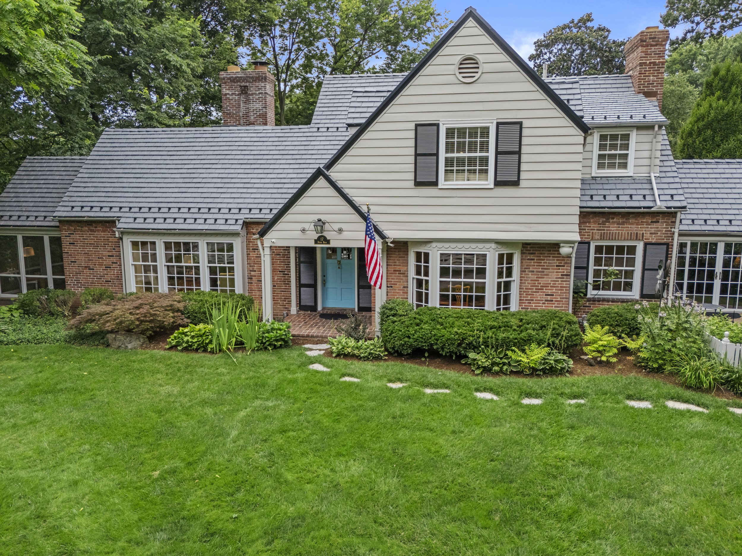 Front entrance of 17 Devon Road showcasing timeless architecture, manicured landscaping, and welcoming curb appeal.
