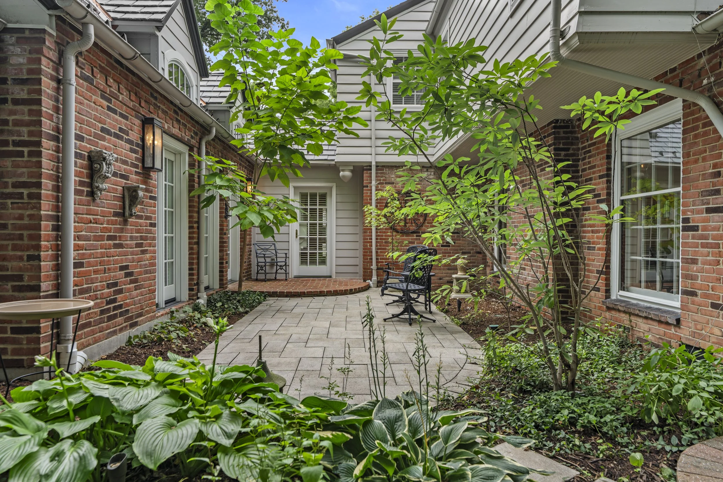 Aerial view of 17 Devon Road highlighting the home's architecture, mature landscaping, and private outdoor living areas.