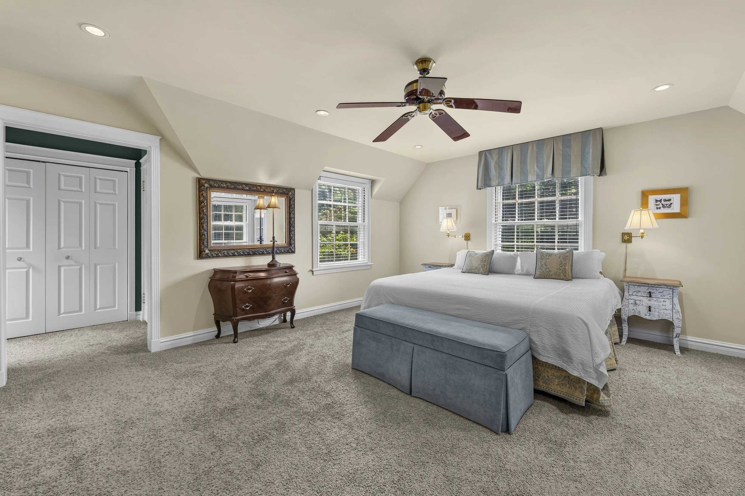 Spacious bedroom offering abundant natural light and comfortable living space.
