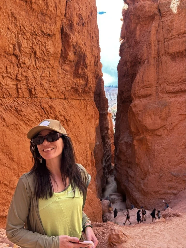 Kylie Ransom outdoors, reflecting her passion for healthy living, strength, and helping women create sustainable wellness.