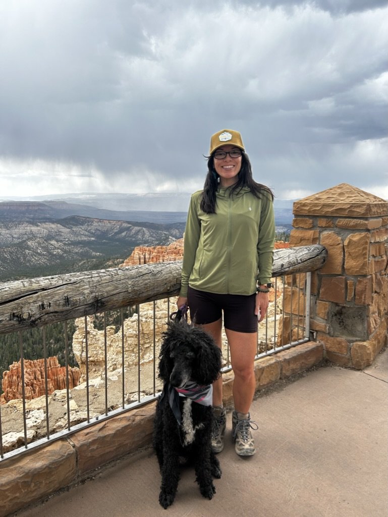 Kylie Ransom enjoying the outdoors with her dog, reflecting her balanced approach to healthy living and wellness.