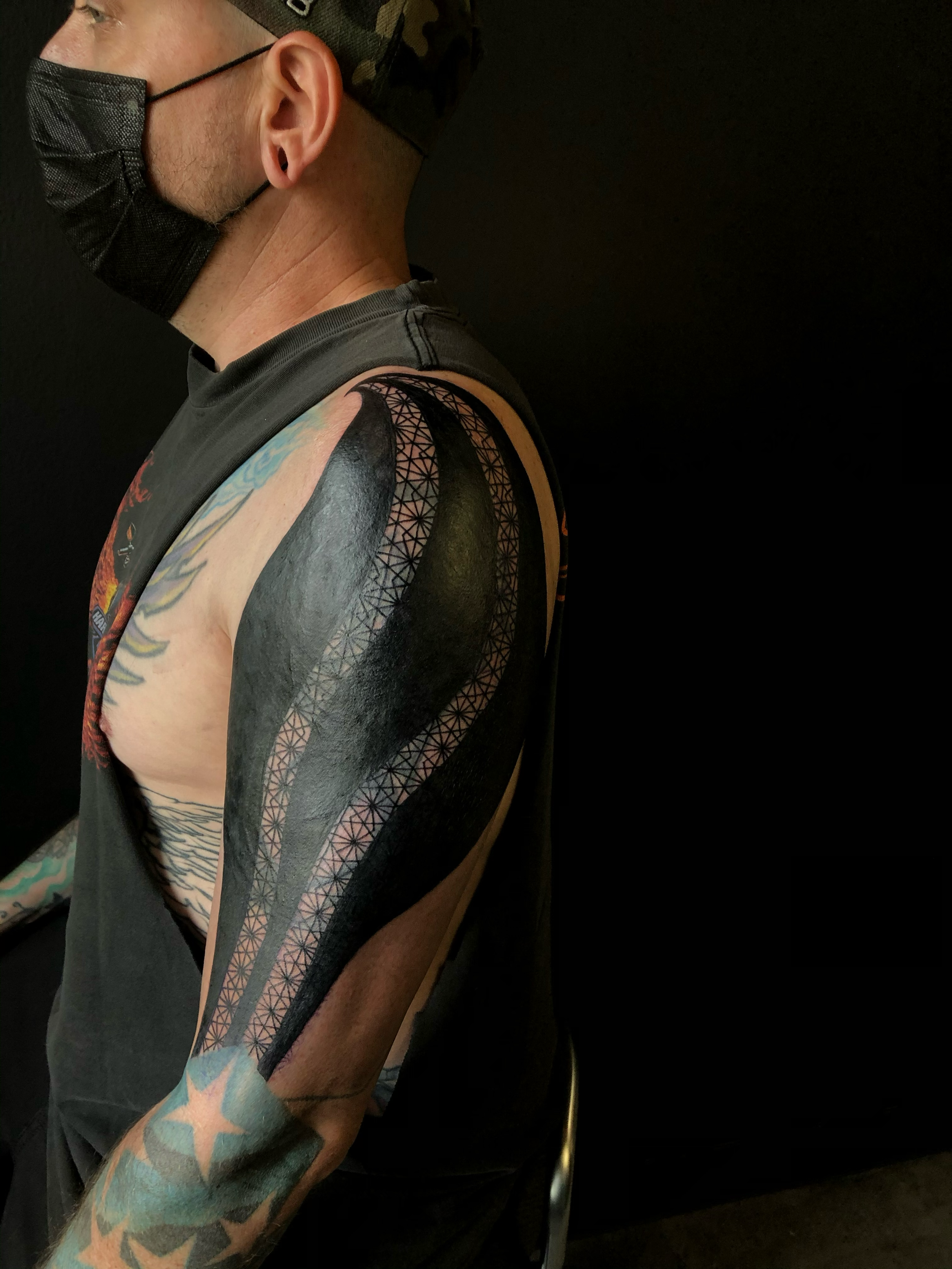 blackout cover up, blast over, with geometric accenting 