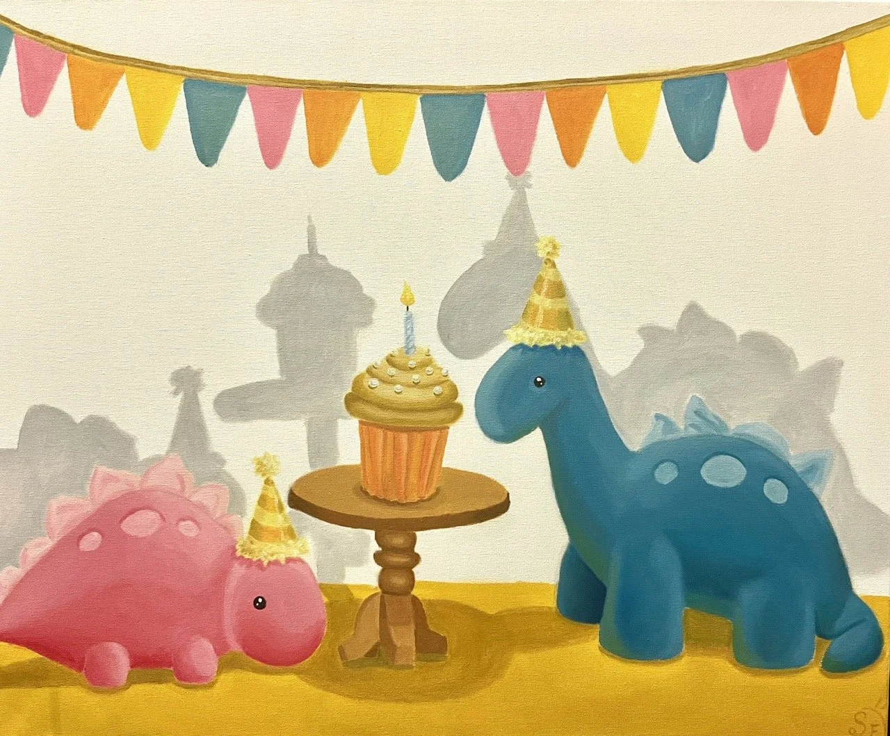 Original illustration made with oil paint on canvas of a colorful birthday party scene with two dinosaur plush toys wearing party hats, a cupcake with a candle on a wooden table, and a colorful banner overhead. One dinosaur is pink, the other blue.