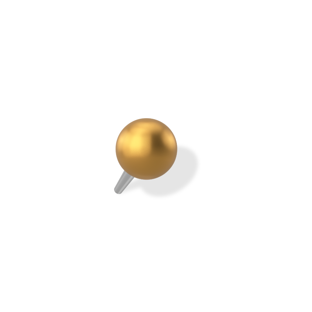 Close-up of a gold-colored spherical object attached to a thin wire against a black background.
