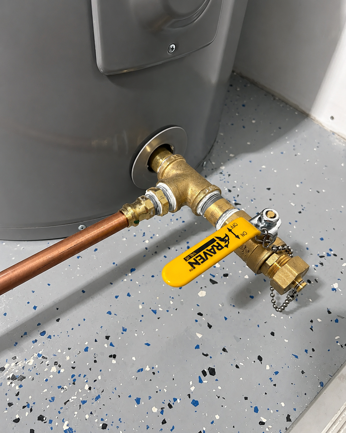 Licensed plumber repairing a residential water heater in Pensacola, Florida.