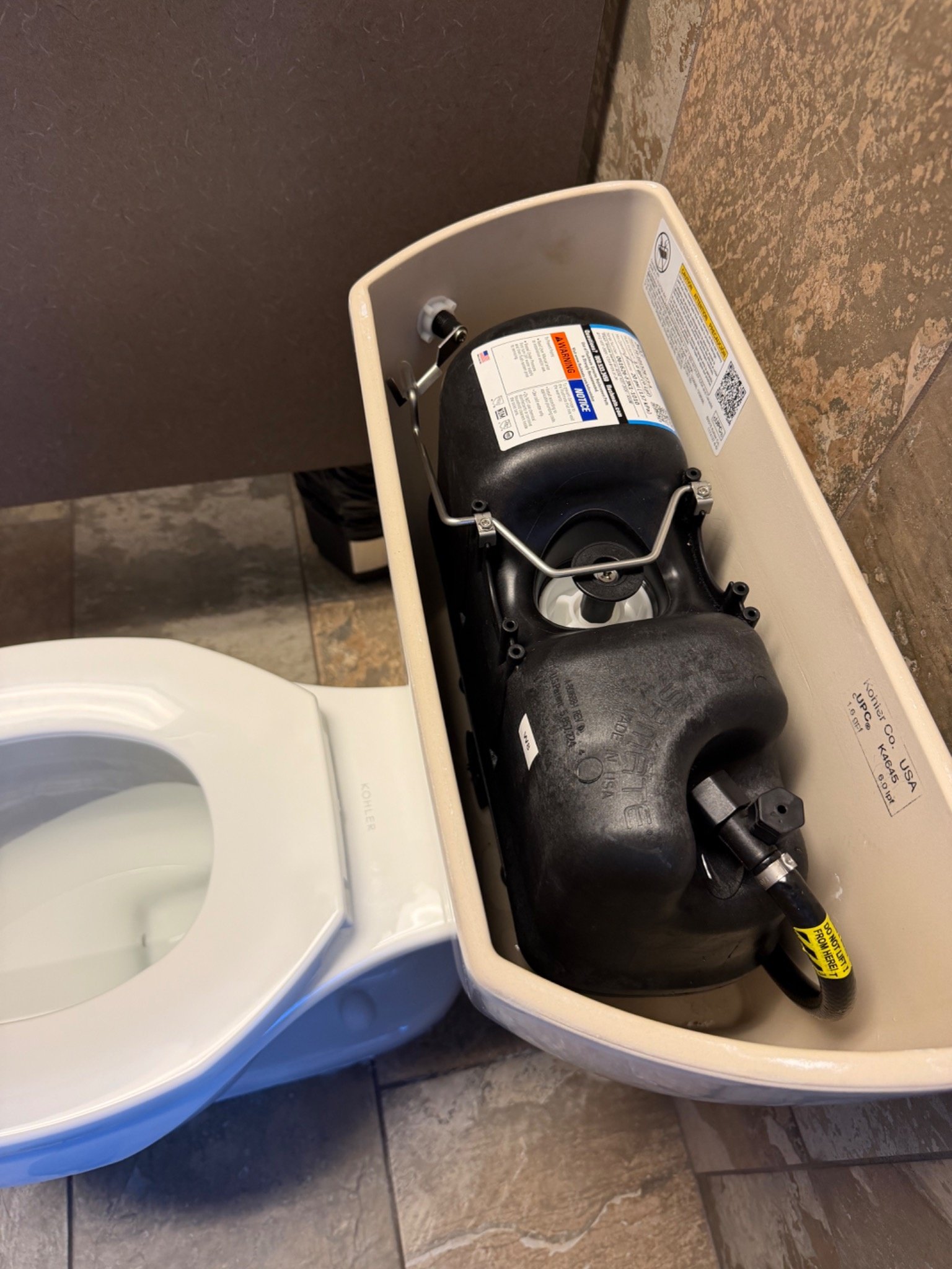 Pressure-assist toilet tank system installed by a Master Plumber in Pensacola, Florida