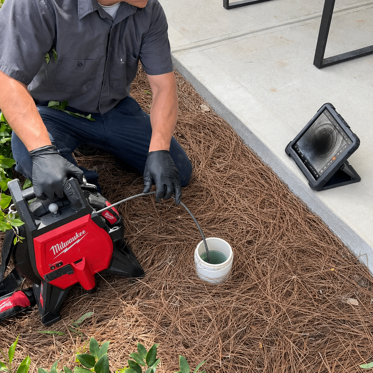 Shoreline Plumbing Master Plumber performing a drain cleaning and sewer camera inspection in Pensacola, Florida