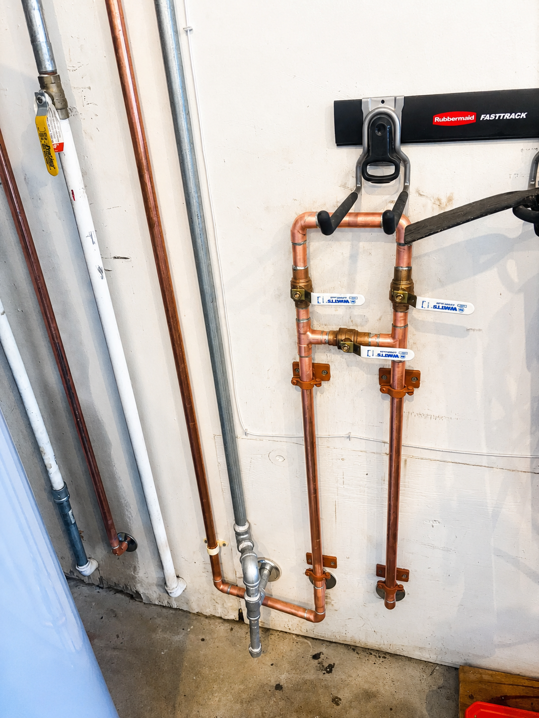 New copper water lines and shutoff valves installed during a whole-home repiping project in Pensacola, Florida