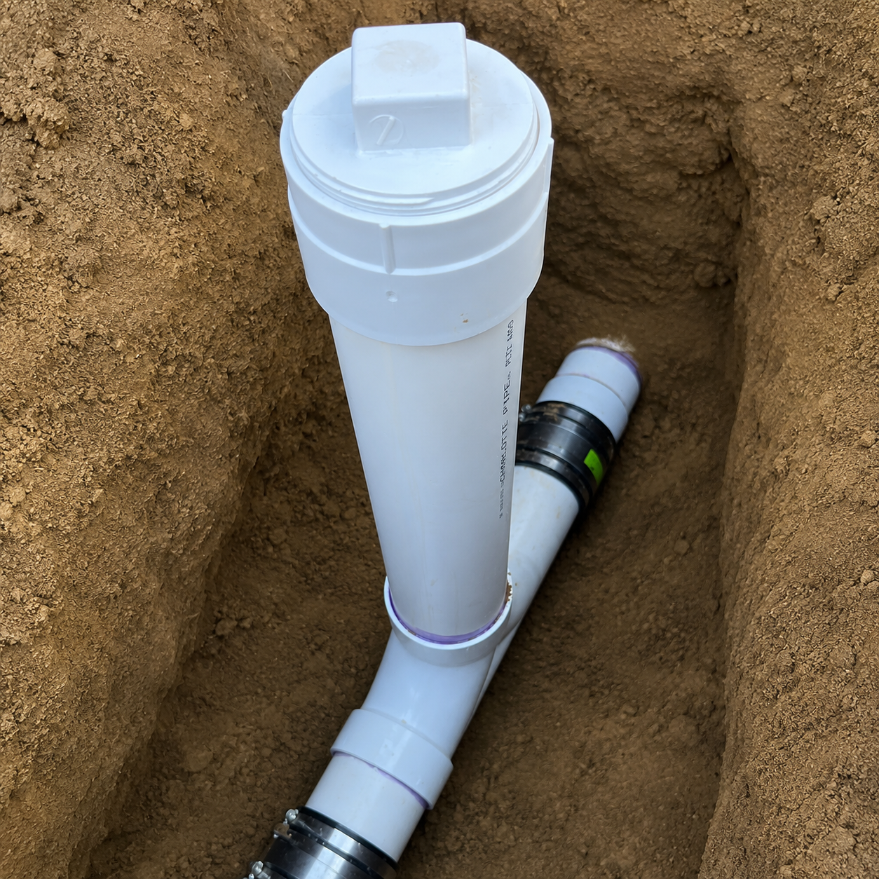 New PVC sewer line and cleanout installed during a sewer repair and replacement in Pensacola, Florida