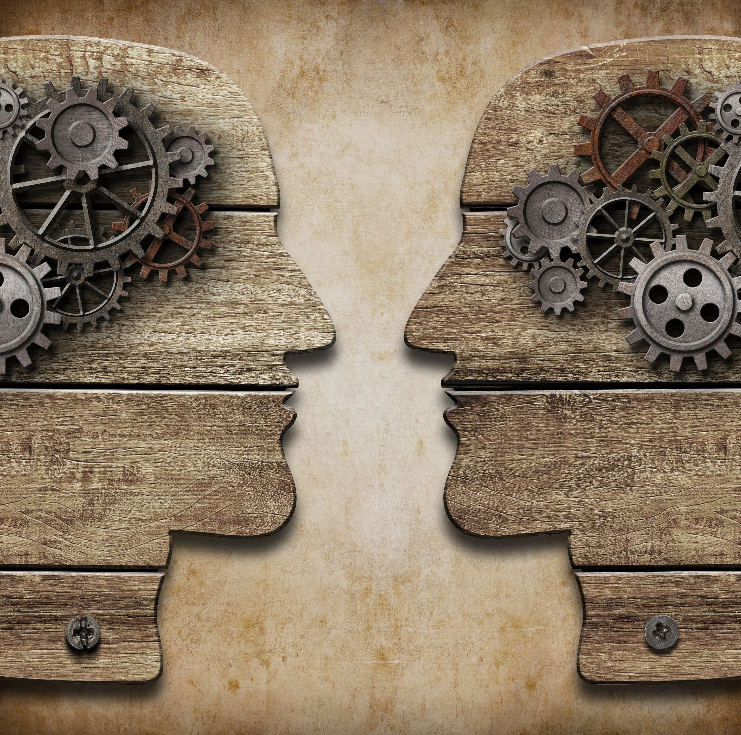 Illustration of two head silhouettes filled with interlocking gears