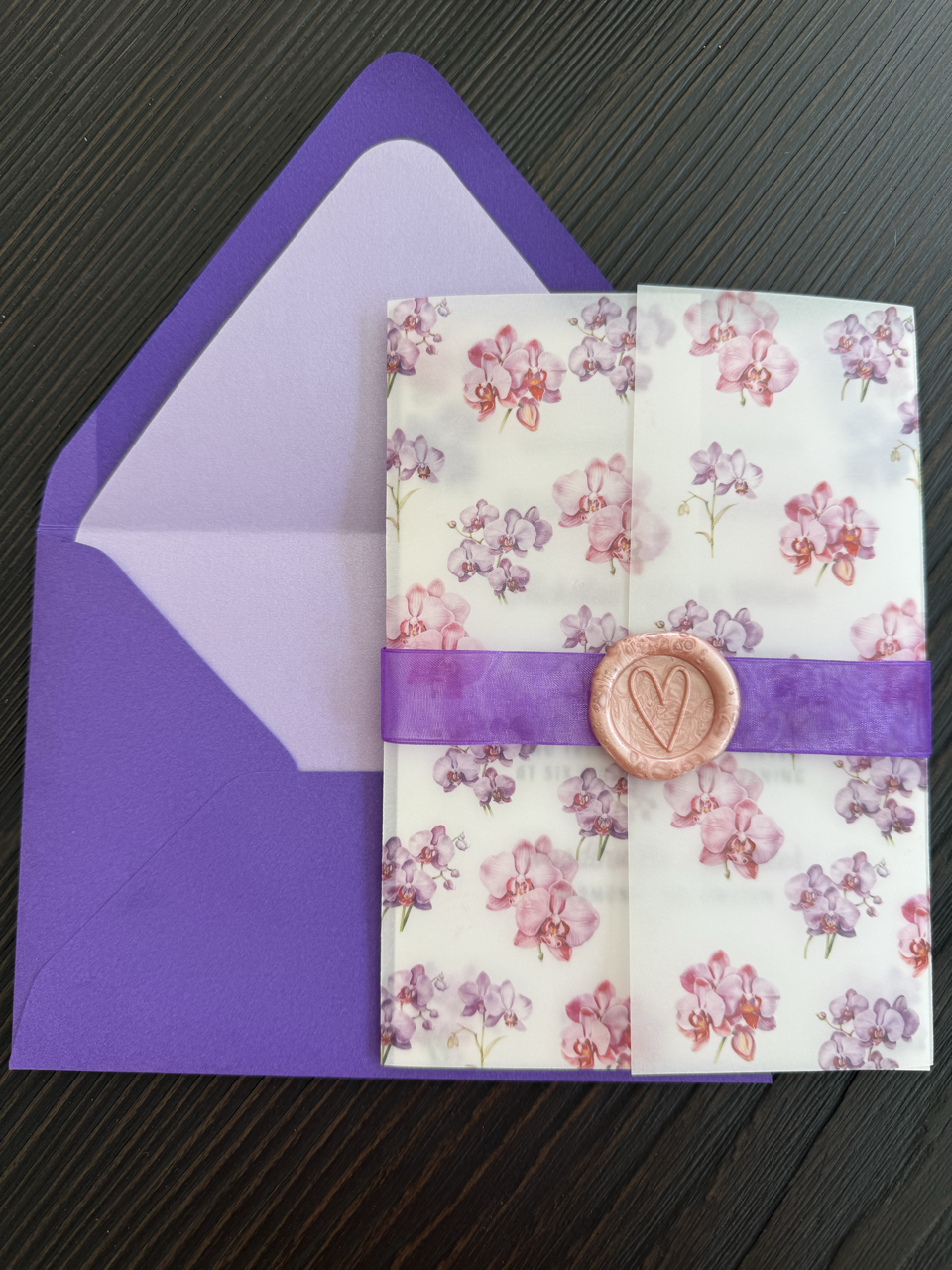 Orchid vellum wrap wedding invitation
