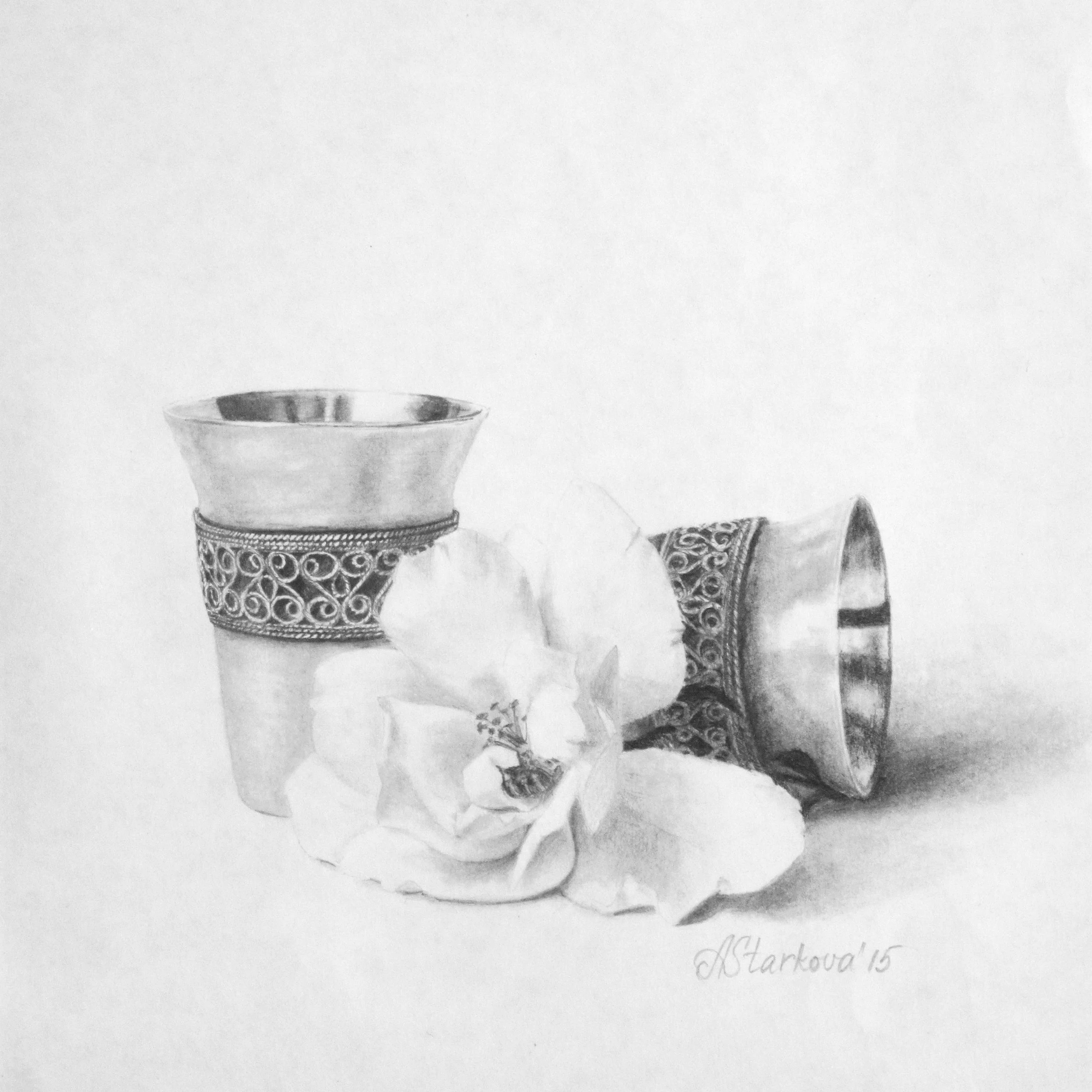 A black and white drawing of a set of two silver shots and with intricate decorative patterns, there is a rose in front of the shots.