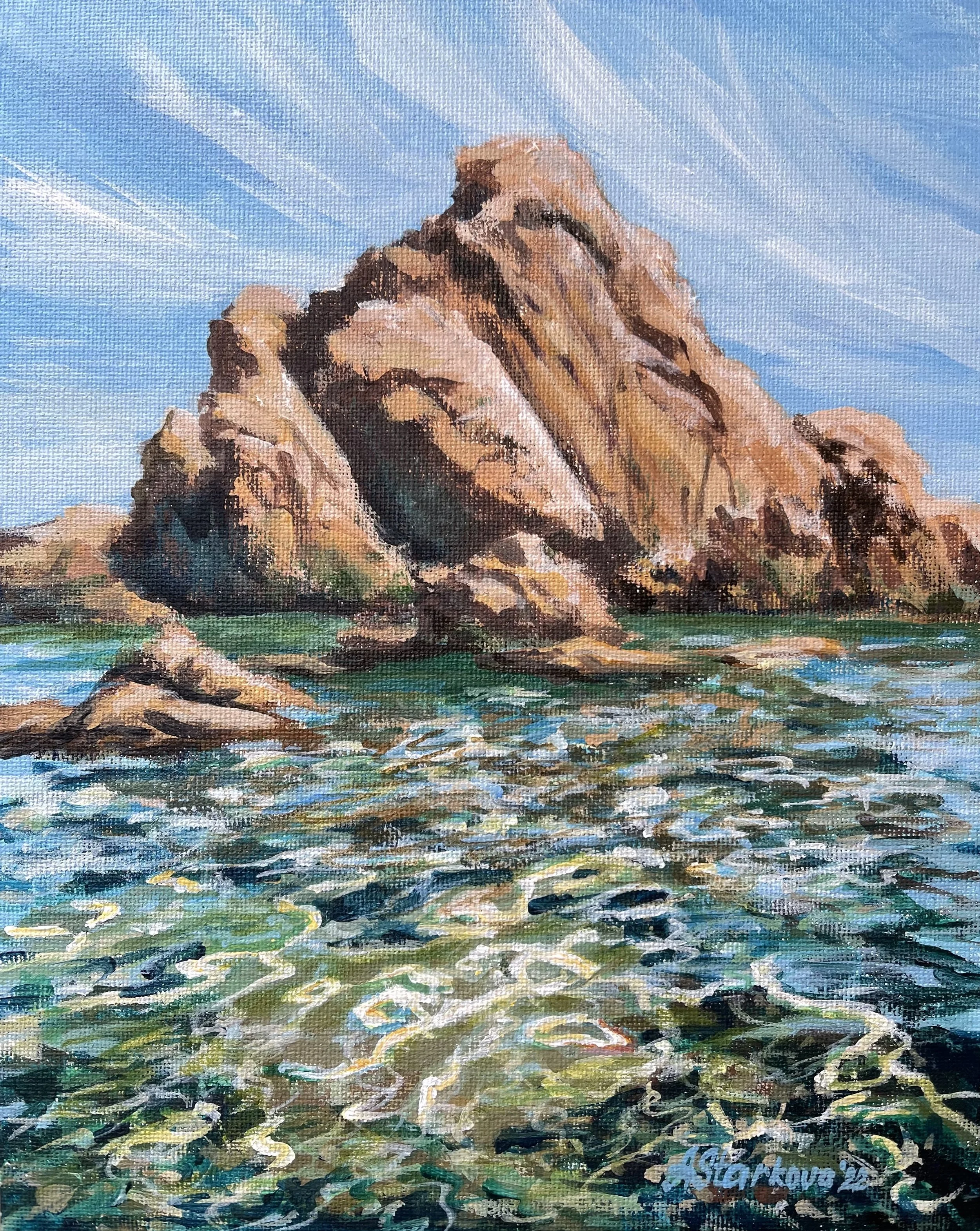 A seascape painting of a rocky coastline with crystal clear water sparkling in front of the rock.