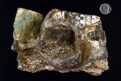 Beryl - Large beryl crystals are not uncommon in granitoid dikes and veins which crosscut the region. During WWII huge amounts of New England beryl crystals were mined and stockpiled for the war effort as it is an important ore for light and strong b