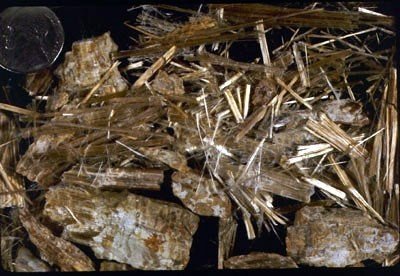 Chrysotile - A dangerous member of the serpentine group of minerals, fine high-aspect-ratio acicular crystals of chrysotile are known irritants to human lung- and stomach tissue. Prolonged exposure can lead to lung cancer. As such, do not breathe in 