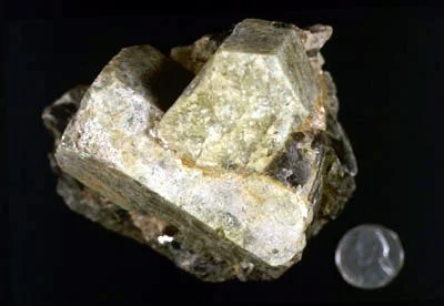 Beryl - Large interpenetrant beryl crystals, these found at 190th Street and Amsterdam Avenue, are commonly associated with granitoid dikes and pegmatite throughout the New England Appalachians. Kunz Collection #69.