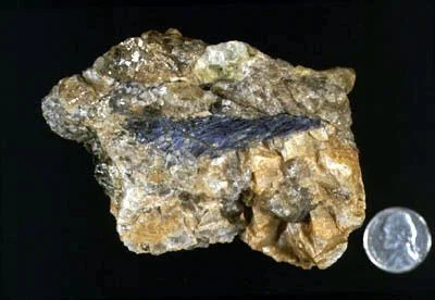 Dumortierite - A rare borosilicate pegmatite mineral found in association with high temperature metamorphism, dumortierite is best known for its use in high-grade porcelain (including spark plug manufacture). Little known from the east coast, importa