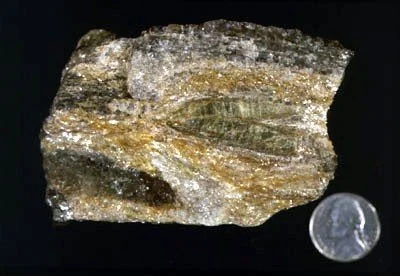 Beryl - Tapered green beryl crystals found in aluminous schist of the Hartland Formation exposed along 94th Street and Riverside Drive. Note the filled fractures parallel to the basal cleavage of the crystals. J. A. Grenzig Collection #X-40, 1899.