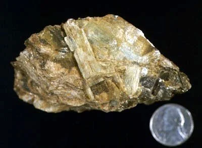 Kyanite - A high pressure aluminosilicate mineral very common to the bedrock units of NYC. It occurs in nodules intergrown with quartz and magnetite and in idioblastic clusters in quartz veins (as pictured here). Clearly similar in quality to the fam