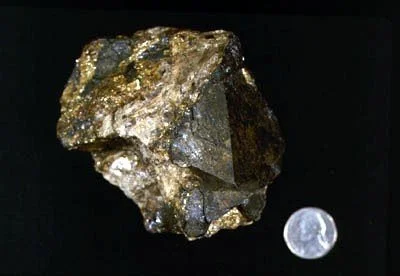 Magnetite - A large octahedral crystal of magnetite in matrix found at 176th Street and Broadway. Manchester Collection #1191