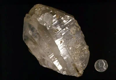 Quartz - A phenomenal parallel-growth crystal from The Bronx found near Westchester Avenue. Large crystals such as these are found along fractures or faults but are uncommon in NYC. Barros Collection #18662.