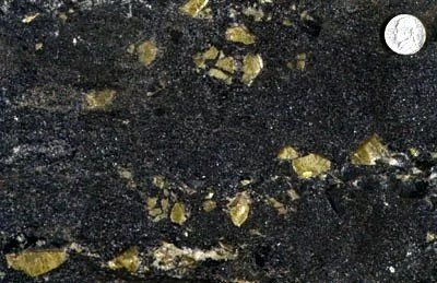 Titanite (Sphene) - Titanite, a calcium titanium silicate is a common accessory mineral in amphibolite and marble units of NYC. The word sphene is derived from the Greek word for wedge, an allusion to the common habit of the mineral. Here, green-colo