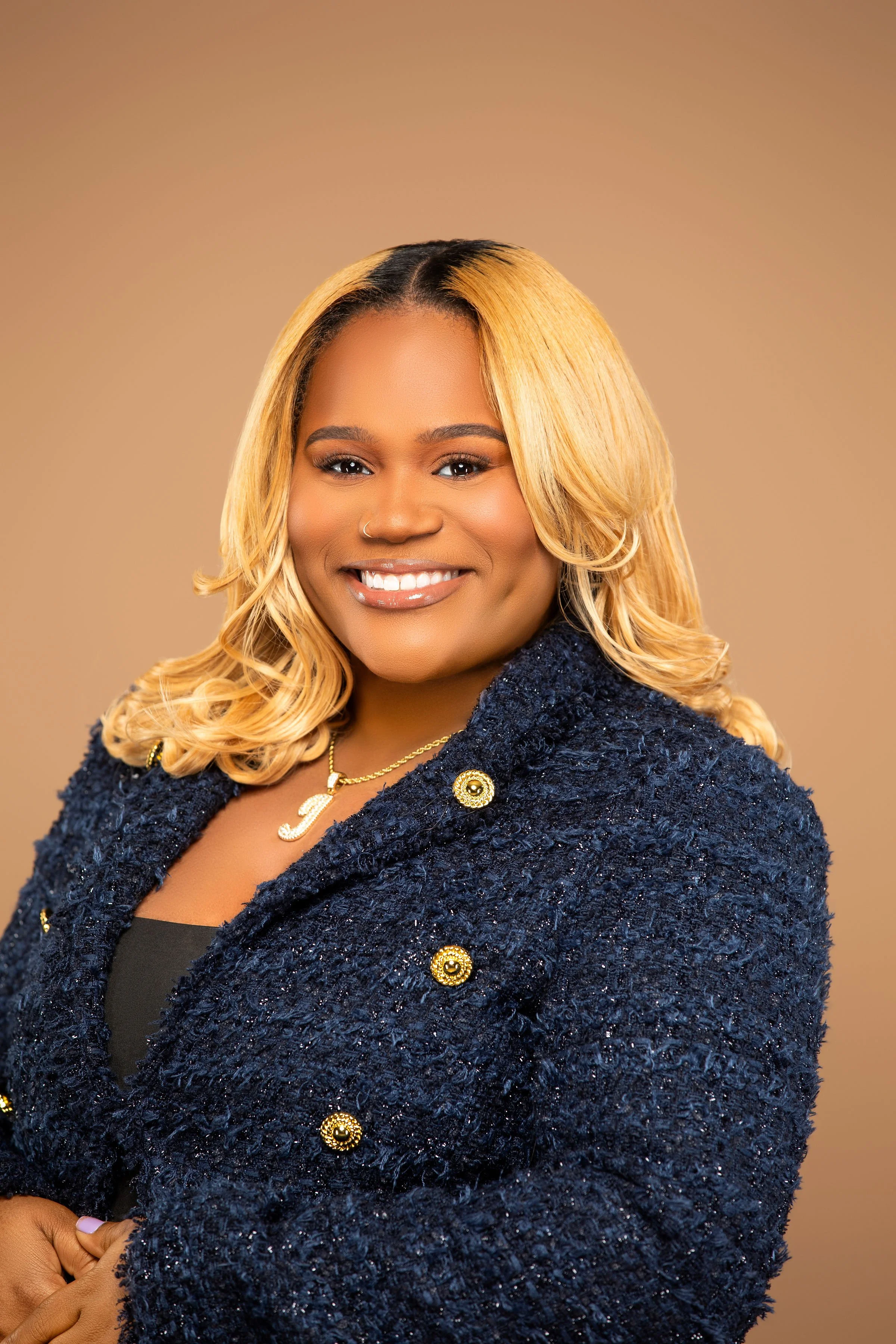r. Jeree Spicer-Arnett, Founder of ReeTheCyberBoss, smiling in professional headshot