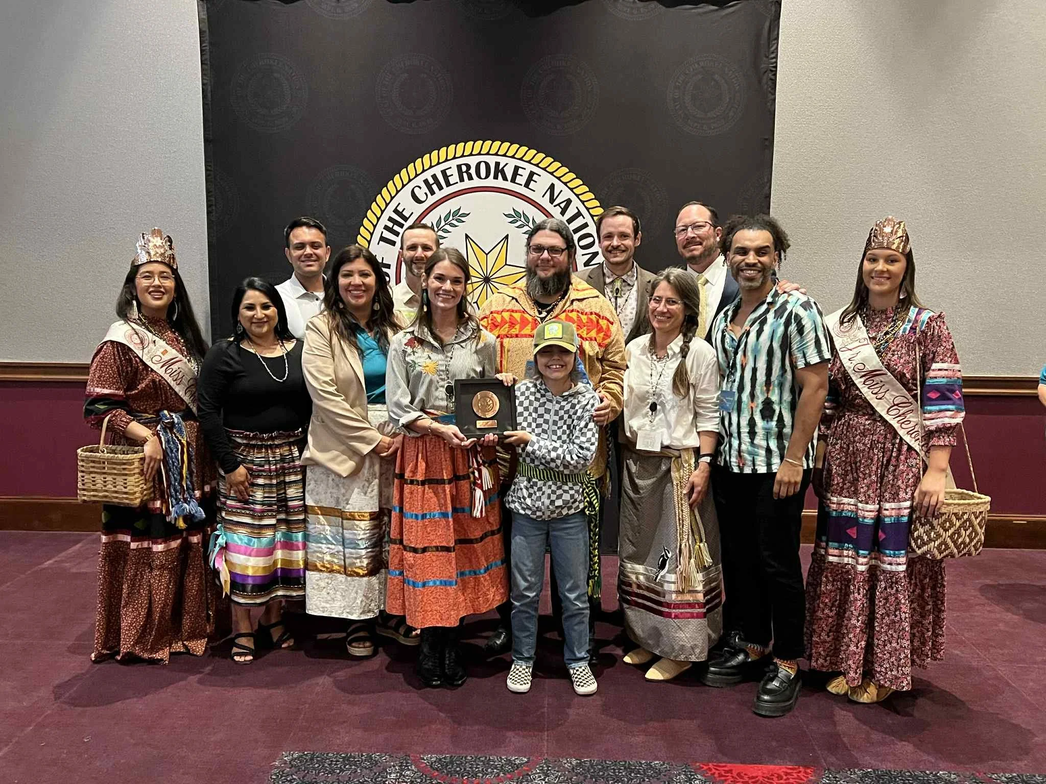 Board members Rachel Caldwell Hill, Doug Martin, Luke Hill, Tomas Boatwright, and Junior Marshall Tony Martin pose with community award and Cherokee Nation Tribal Leadership