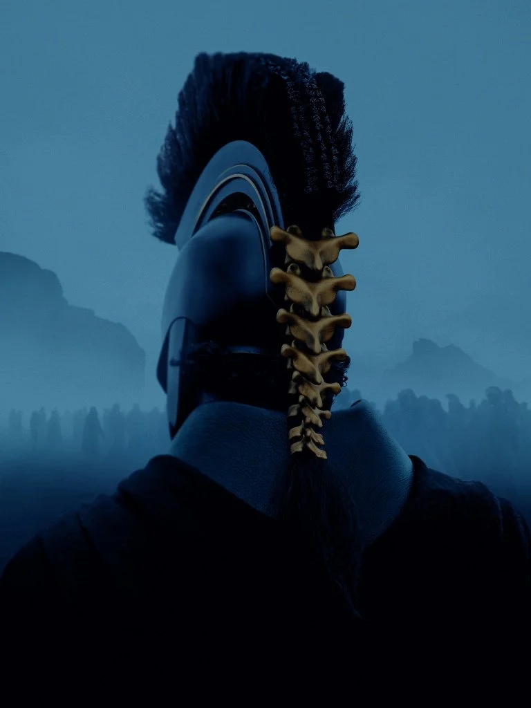 A person wearing a helmet with a horse hair crest and a dragon-like spine on the back, standing in a foggy landscape with mountains and a crowd in the distance.
