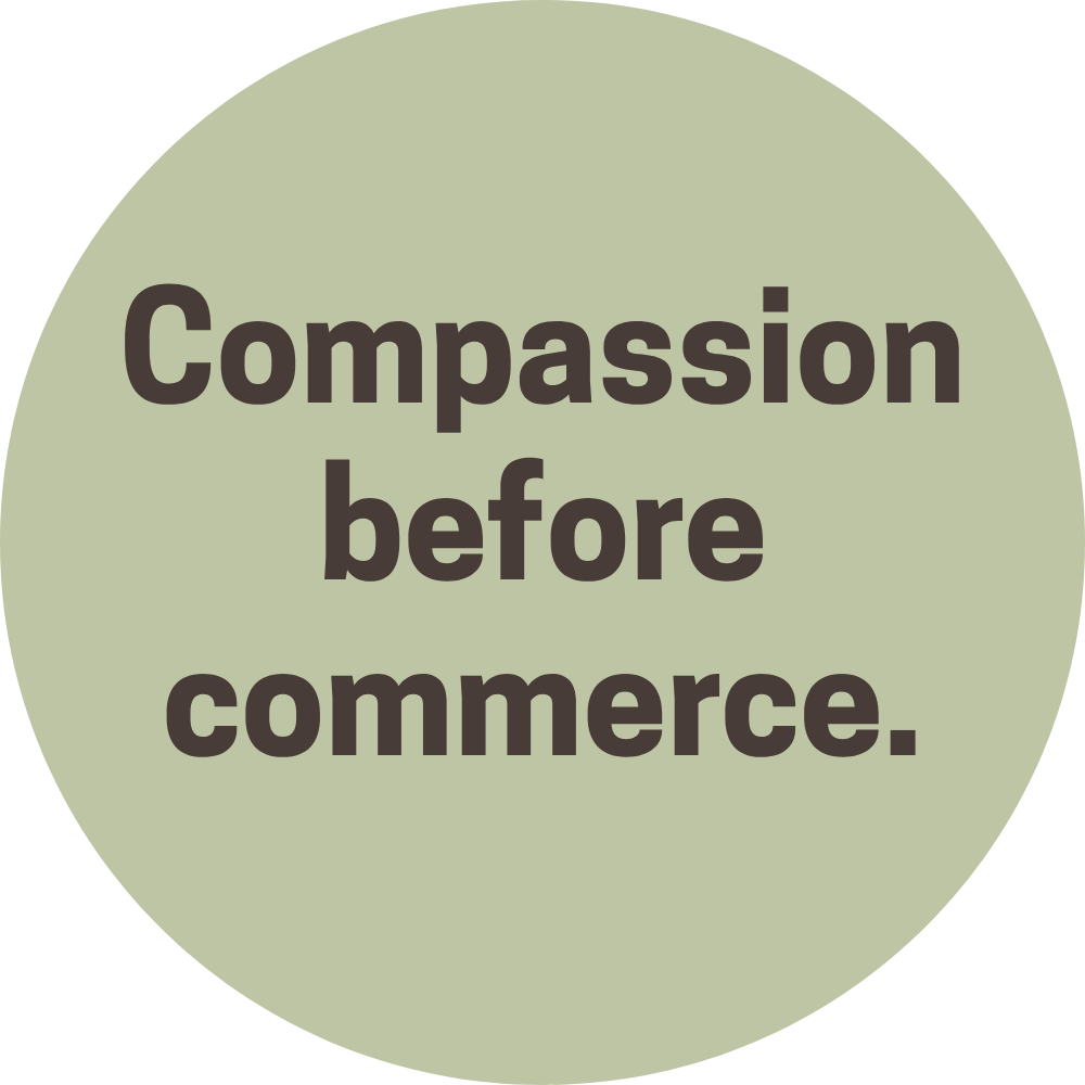 A circle with the words "Compassion before commerce" written inside.