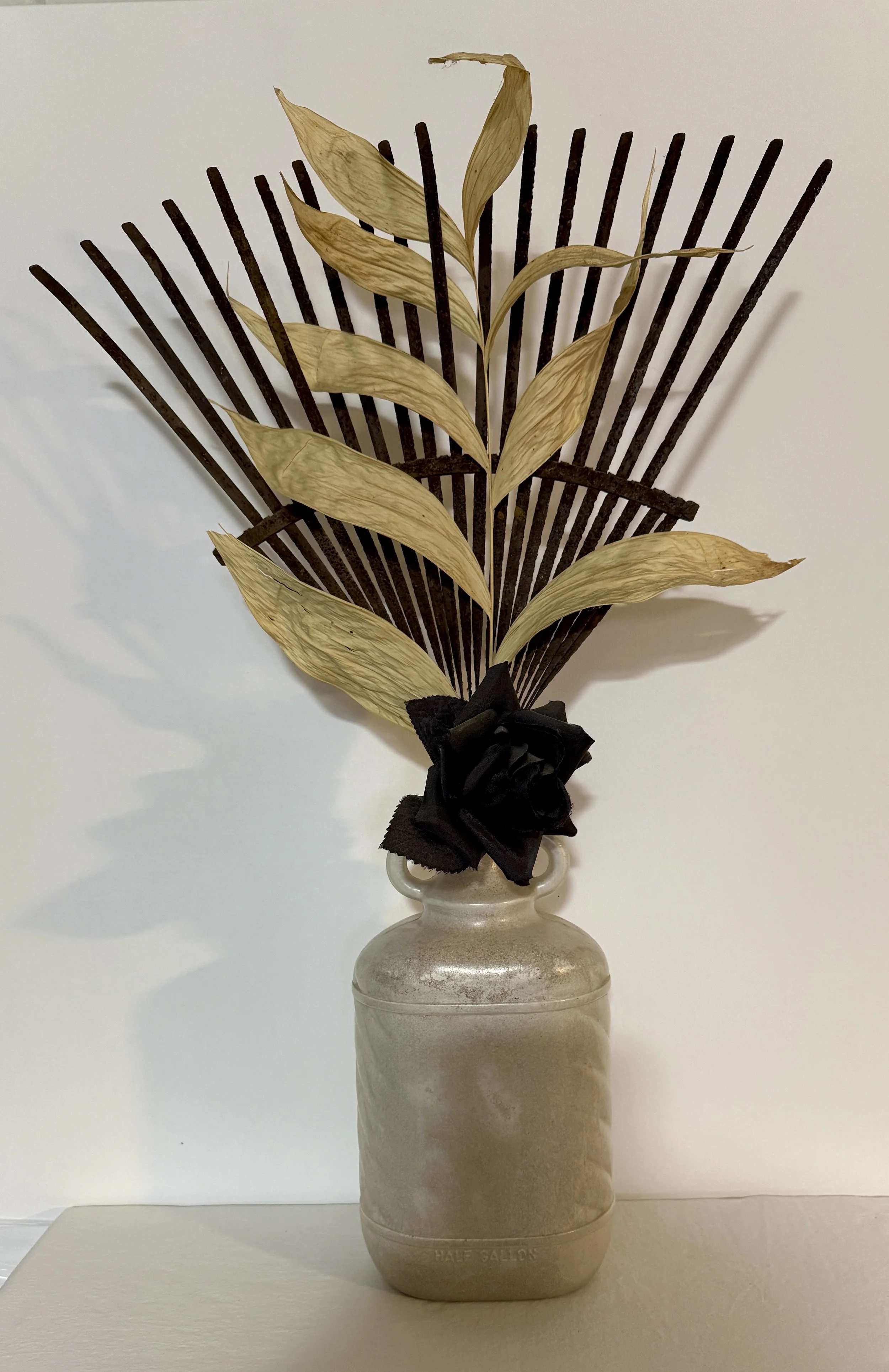  Funerary Field , 2009. Plastic, concrete, rayon, dried palm leaf, steel – 24" X 14.5" X 5" 