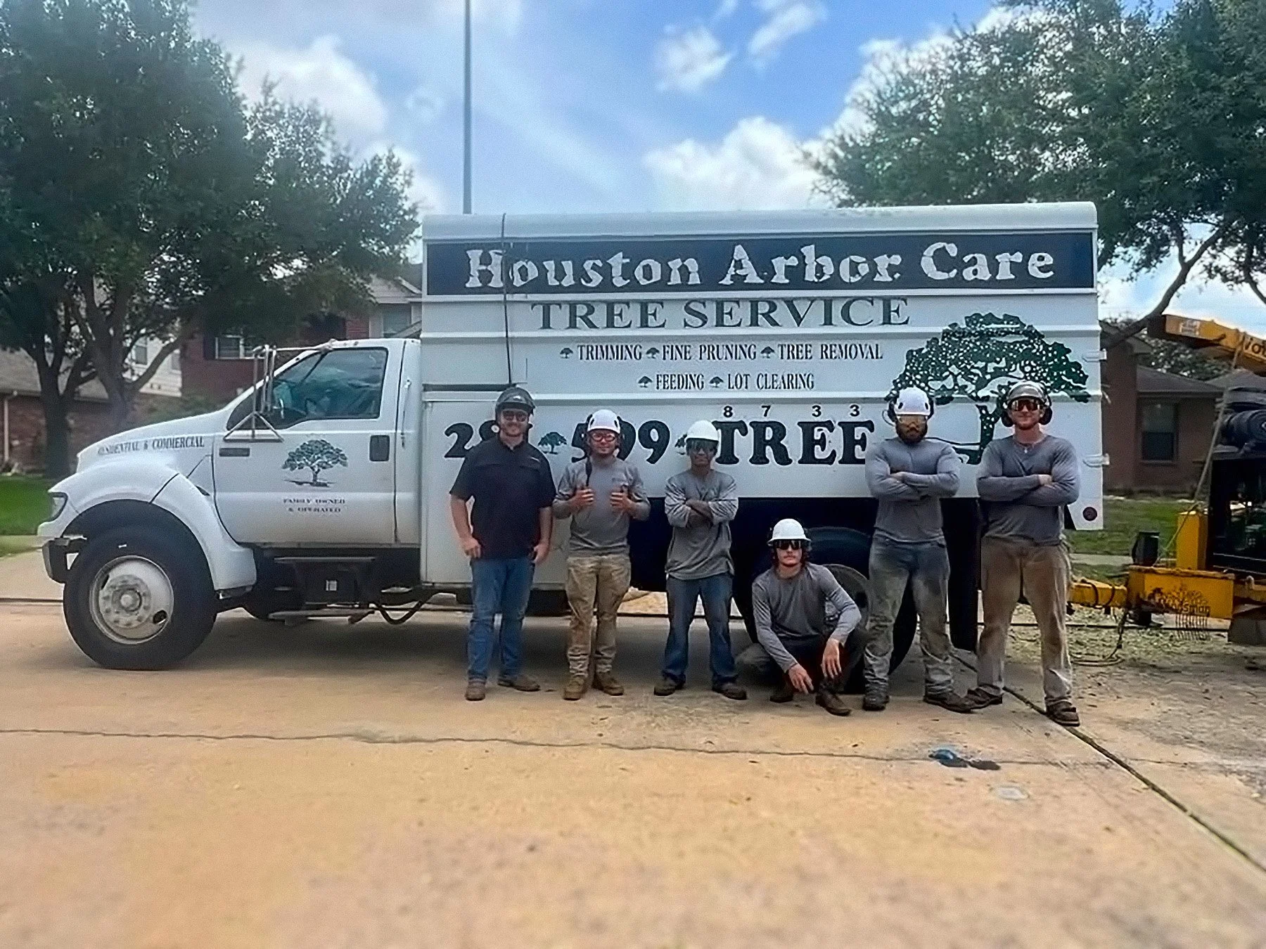 The Houston Arbor Care crew in front of the company tree service truck