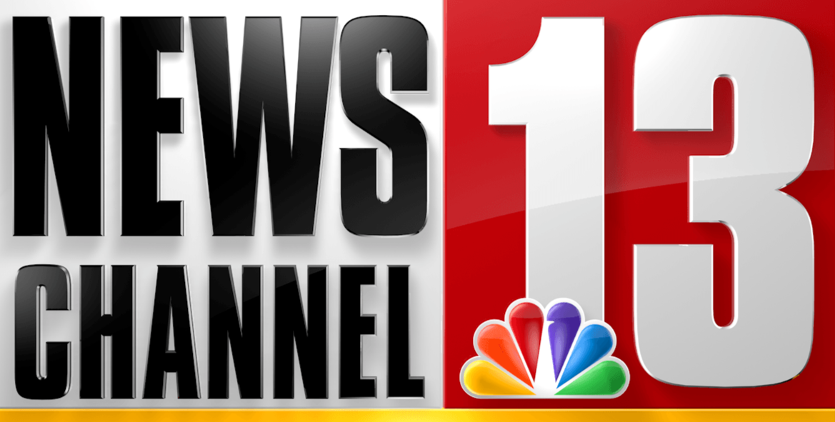 Logo of News 13 Channel, an NBC affiliate, with a red and white background and colorful peacock logo at the bottom.