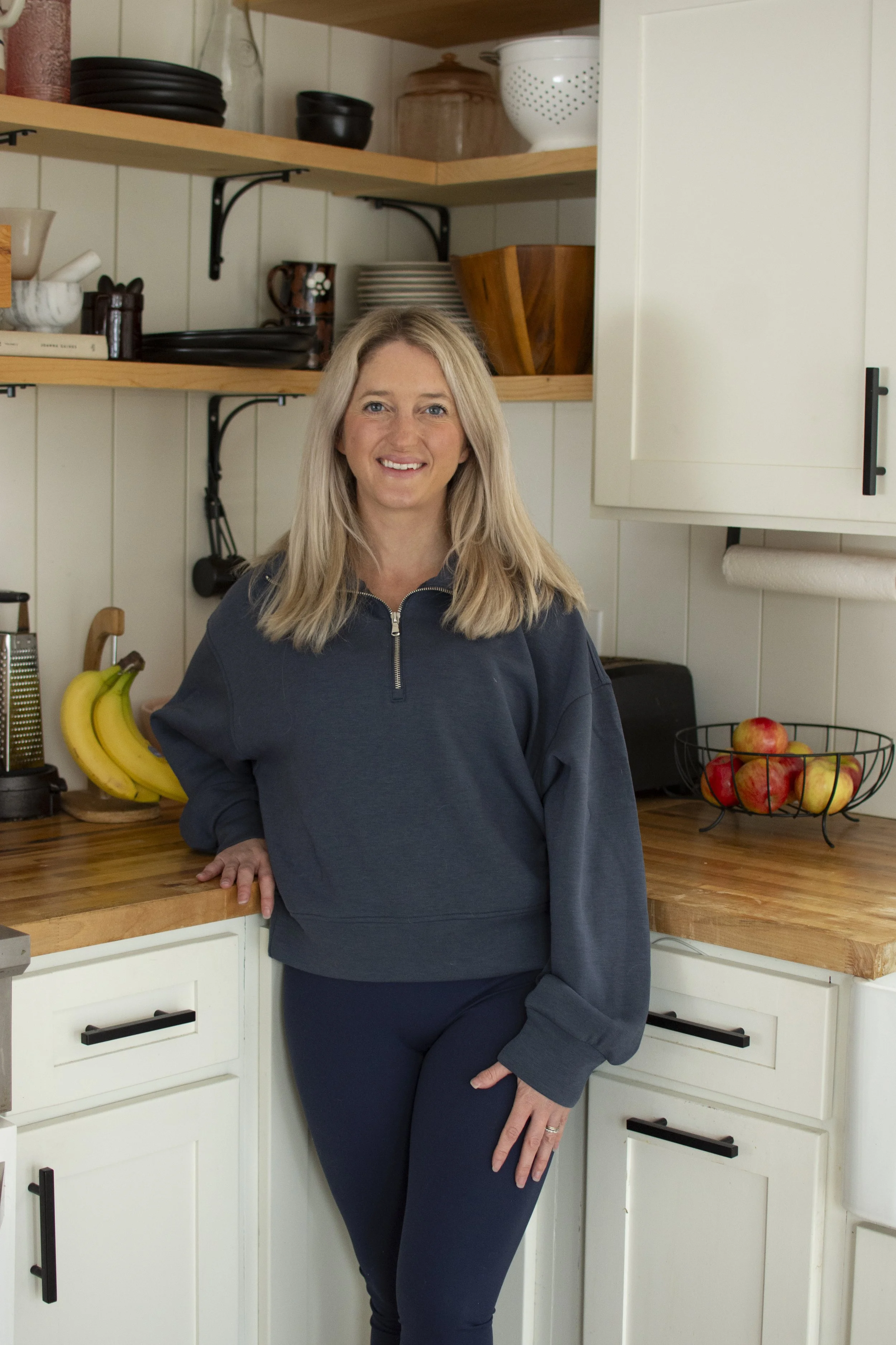 Registered Dietitian Kileigh Job in her kitchen with fresh fruit in Upstate NY