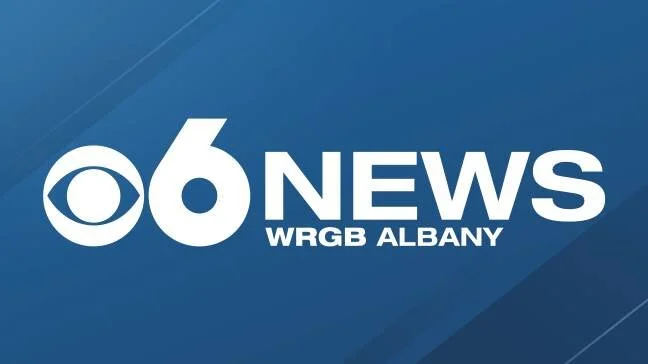 Logo for CBS 6 News WRGB Albany with a blue background.