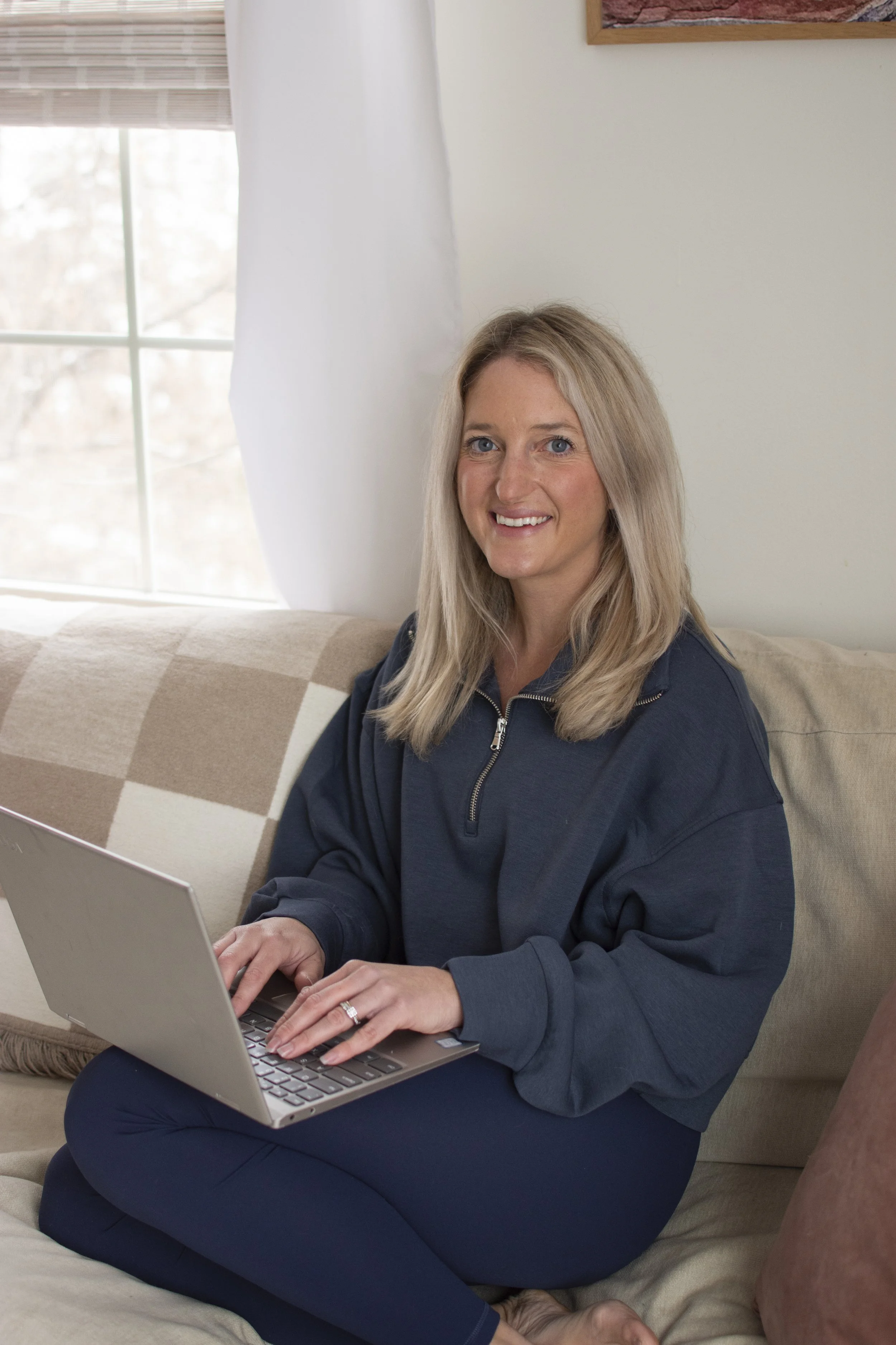 Sports dietitian Kileigh Job working on her laptop at home in Upstate New York