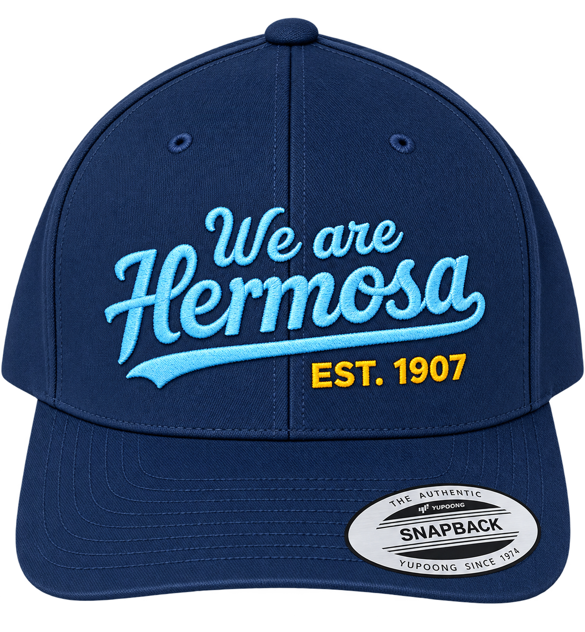 Blue baseball cap with embroidered text: "We are Hermosa" in light blue, and "EST. 1907" in yellow. It has a sticker on the bill that says "THE AUTHENTIC SNAPBACK YUPOONG SINCE 1974."