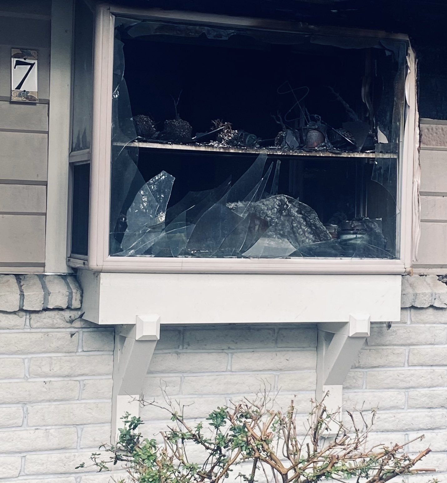 Broken window to home from property damage and vandalism claim
