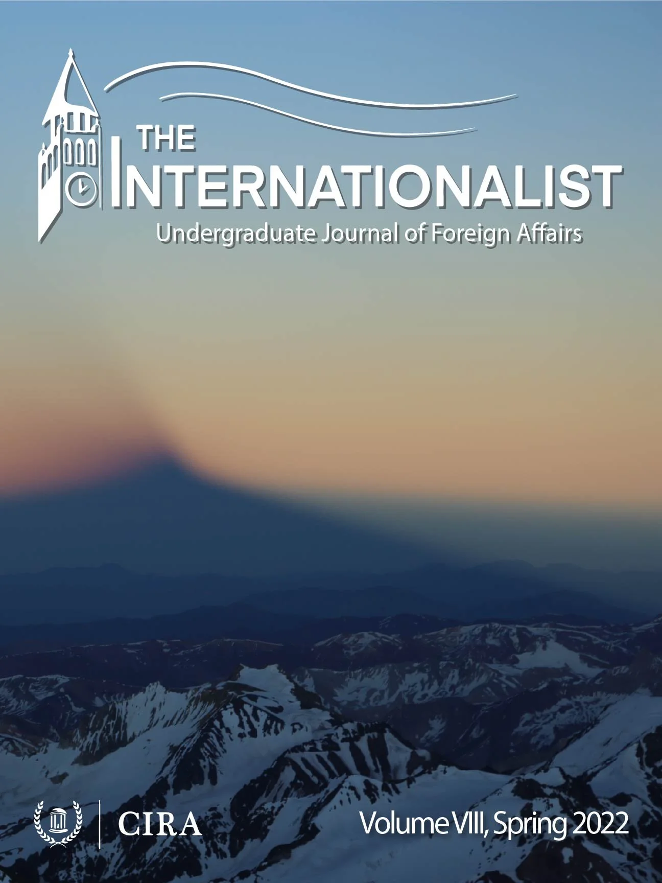 Cover of Spring 2022 Edition, background photo of a snowy mountain top at sunset.
