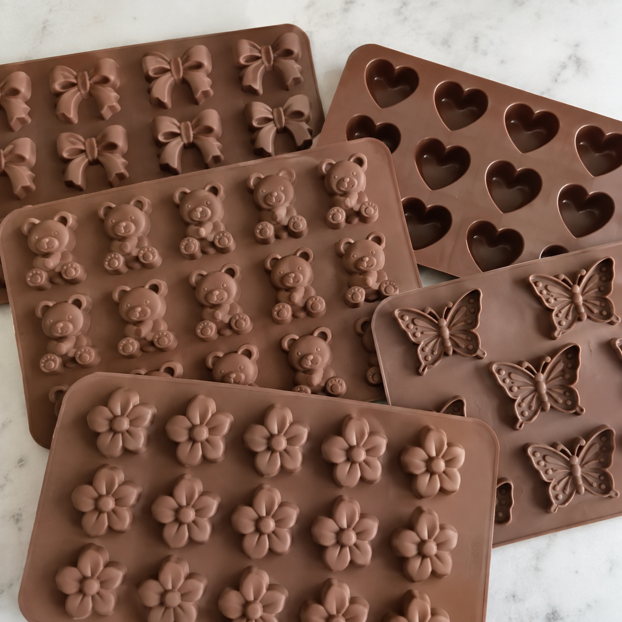 Chocolate molds in bow, heart, bear, butterfly and flower shapes — coming soon