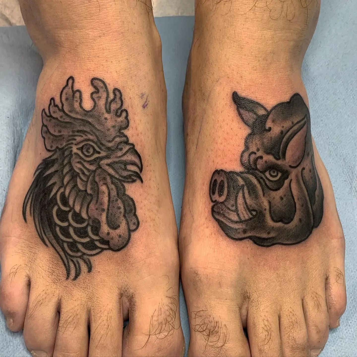  Sailor superstition: pig & rooster on the feet to prevent drowning — done in bold blackwork trad.

